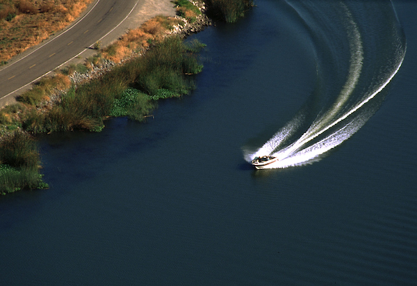 Aerial view of a speedboat traversing the waterways of the Sacramento-San Joaquin River Delta. Photo taken May 26, 2004. Paul Hames / California Department of Water Resources