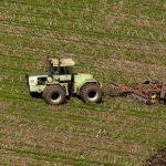 Aerial view of a farmer plowing a field near Sacramento, California. Paul Hames / California Department of Water Resources