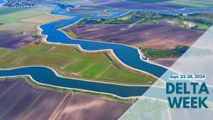 Graphic that includes an aerial view of the Sacramento-San Joaquin Delta's landscape, with winding waterways and agricultural fields. A text overlay reads: Sacramento-San Joaquin Delta Week, September 22-28, 2024.